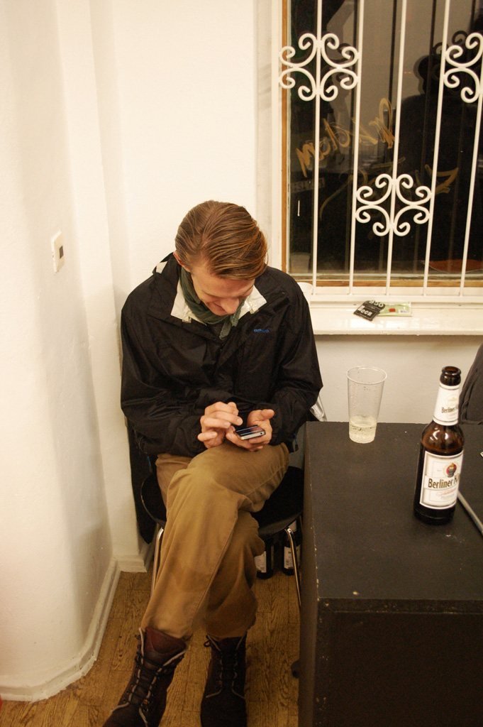 local.#non.access — a visitor browsing the show by the barred window