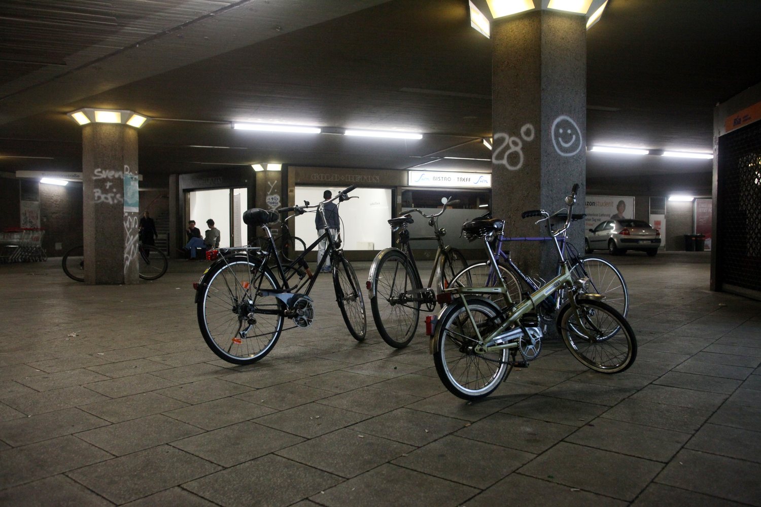 LocalNonOffline — bicycles under the concrete passage by the Sion bistro