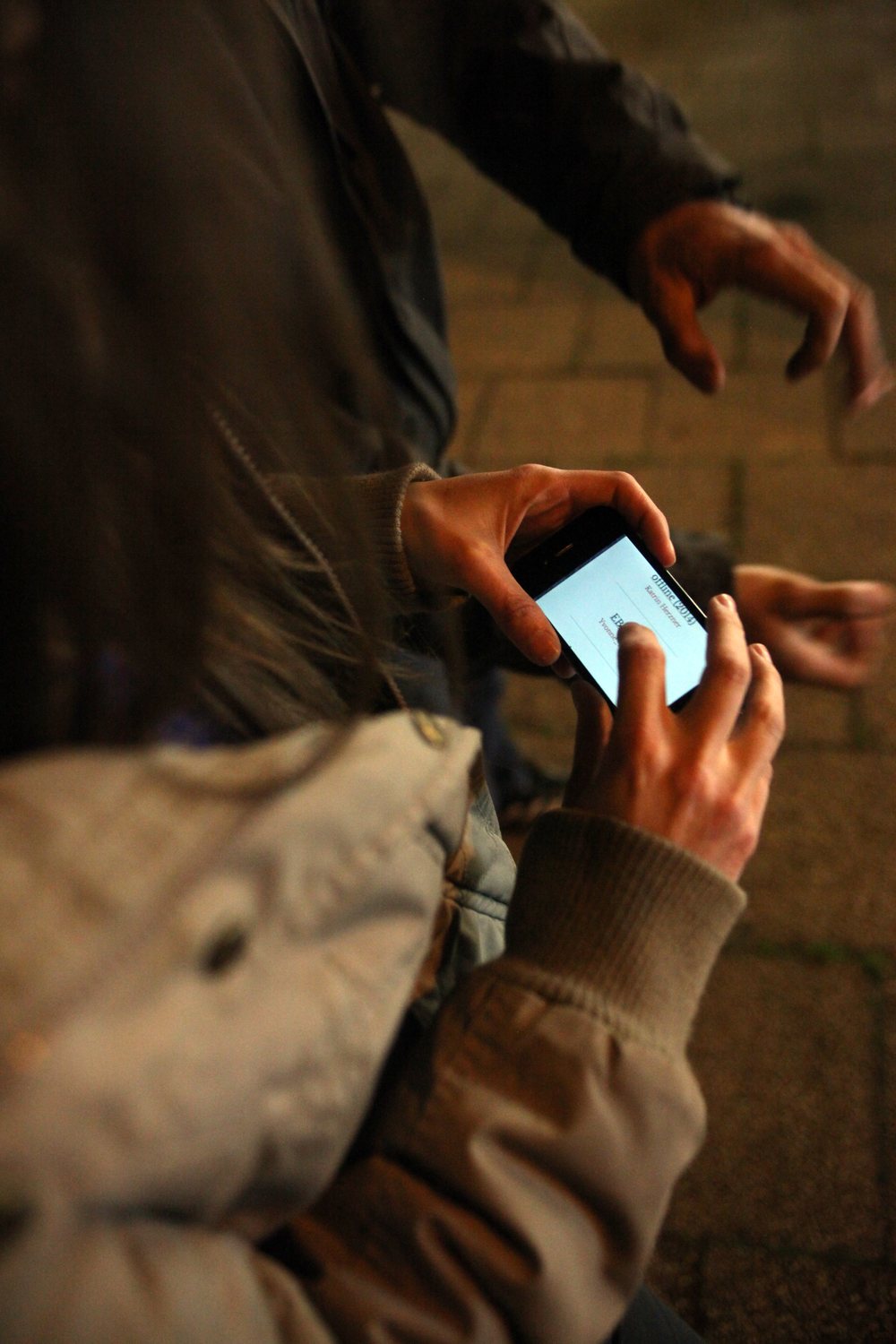 LocalNonOffline — hands tapping the offline page on a phone at night